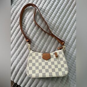 Knock off Louis Vuitton small purse. Brand new.
